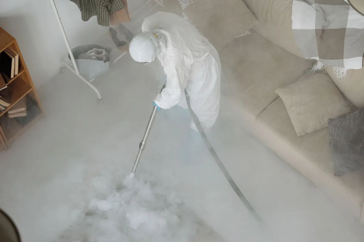 Biohazard cleanup technician in protective equipment, Independence, MO